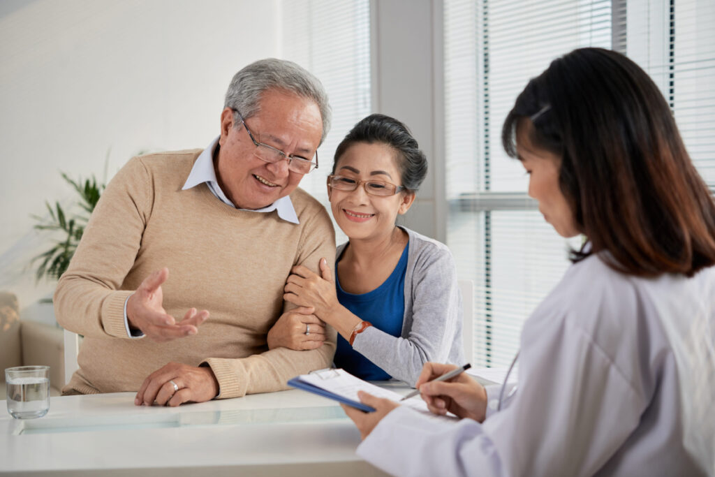 wellnessme-A warm and engaging consultation between a healthcare professional and a couple.